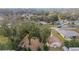 An aerial view of the neighborhood showing the tree coverage and nearby houses at 4837 Ne 5Th Street Rd, Ocala, FL 34470