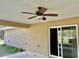 Relaxing outdoor patio with ceiling fan, perfect for enjoying the outdoors at 5765 Sw 164Th Pl, Ocala, FL 34473