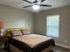 Comfortable bedroom with plush bed, cozy textiles, and ample natural light, creating a relaxing atmosphere at 5765 Sw 164Th Pl, Ocala, FL 34473