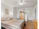 Bedroom featuring wood floors, closet, and a decorative mirror shelf with decorative items at 6994 Nw 320 Hwy, Micanopy, FL 32667