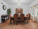 Elegant dining room with a chandelier, hardwood floors, and ample seating at 6994 Nw 320 Hwy, Micanopy, FL 32667