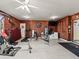 Home gym with various exercise equipment including weights, a treadmill, and a bench at 6994 Nw 320 Hwy, Micanopy, FL 32667