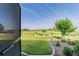 Backyard view from the lanai featuring a lush green lawn and well-maintained landscaping at 8107 Sw 92Nd Cir, Ocala, FL 34481