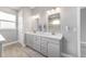 Bathroom showcasing a double vanity with modern fixtures, a large mirror, and a walk-in shower at 8107 Sw 92Nd Cir, Ocala, FL 34481