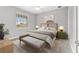 Cozy bedroom featuring neutral tones, a plush bed, a window, and stylish furnishings at 8107 Sw 92Nd Cir, Ocala, FL 34481