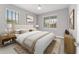 Cozy bedroom features plush carpet, neutral walls, and natural light from windows at 8107 Sw 92Nd Cir, Ocala, FL 34481
