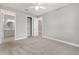 Bedroom with a ceiling fan and a view to an ensuite bathroom at 8107 Sw 92Nd Cir, Ocala, FL 34481