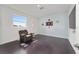 Bonus room featuring a recliner, accent table, and natural light at 8107 Sw 92Nd Cir, Ocala, FL 34481