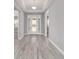 Welcoming foyer with wood-look flooring and access to multiple rooms at 8107 Sw 92Nd Cir, Ocala, FL 34481