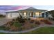 Beautiful single-story home featuring a well-manicured lawn and inviting front porch at dusk at 8107 Sw 92Nd Cir, Ocala, FL 34481