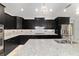 Close-up of the stylish kitchen featuring granite countertops, a gas stove, and stainless steel appliances at 8107 Sw 92Nd Cir, Ocala, FL 34481