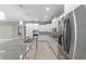 Contemporary kitchen featuring a large island, granite countertops, and stainless steel appliances at 8107 Sw 92Nd Cir, Ocala, FL 34481