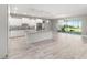 Spacious kitchen with white cabinetry, granite counters, large island, and stainless-steel appliances at 8107 Sw 92Nd Cir, Ocala, FL 34481