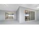Open lanai showing access to the interior and outdoor views from sliding glass doors at 8107 Sw 92Nd Cir, Ocala, FL 34481
