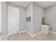 A charming laundry room with wood flooring, laundry sink and plenty of space at 8107 Sw 92Nd Cir, Ocala, FL 34481