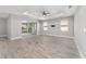 Spacious living room featuring a tray ceiling, recessed lighting and access to the patio at 8107 Sw 92Nd Cir, Ocala, FL 34481
