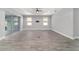 Living room includes recessed lighting, wood-look tile flooring, sliding glass doors, and a ceiling fan at 8107 Sw 92Nd Cir, Ocala, FL 34481