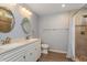 Bathroom featuring double sinks, a tiled shower and updated fixtures at 8231 Sw 108Th Loop, Ocala, FL 34481