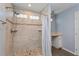 Bathroom featuring a walk-in shower with stone flooring and neutral toned tile at 8231 Sw 108Th Loop, Ocala, FL 34481