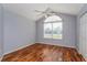 Light and airy bedroom with wood-look flooring and a high vaulted ceiling at 8231 Sw 108Th Loop, Ocala, FL 34481