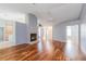 Spacious living room featuring hardwood floors, a fireplace, and neutral paint at 8231 Sw 108Th Loop, Ocala, FL 34481