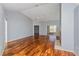 Bright living room with hardwood floors, a ceiling fan, and sliding glass doors at 8231 Sw 108Th Loop, Ocala, FL 34481