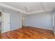 Main bedroom with hardwood floors and a ceiling fan at 8231 Sw 108Th Loop, Ocala, FL 34481