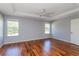 Main bedroom featuring hardwood floors, natural light and a ceiling fan at 8231 Sw 108Th Loop, Ocala, FL 34481