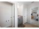 Well-lit bathroom featuring a gray vanity with granite countertop and tile flooring at 8953 Sw 50Th Ter, Ocala, FL 34476