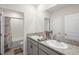 Bathroom featuring granite countertops and a vanity with dual sinks, plus tile flooring at 8953 Sw 50Th Ter, Ocala, FL 34476