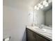 Bright bathroom with a gray vanity, sink and white counter at 9105 Se 55Th Ter, Ocala, FL 34480