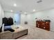 Neutral bedroom featuring a soft daybed, dresser and carpeted floor at 9105 Se 55Th Ter, Ocala, FL 34480