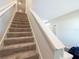 Carpeted staircase with white railing at 9105 Se 55Th Ter, Ocala, FL 34480