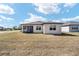 Expansive backyard view, highlighting the outdoor space and home's architectural design at 9184 Sw 57Th Place Rd, Ocala, FL 34481