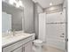 This bathroom features grey walls, white subway tile, and brushed nickel fixtures at 9184 Sw 57Th Place Rd, Ocala, FL 34481