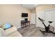 This bedroom features neutral walls, wood-look floors, and a sliding closet door at 9184 Sw 57Th Place Rd, Ocala, FL 34481