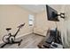 This bedroom features neutral walls, wood-look floors, and a sliding closet door at 9184 Sw 57Th Place Rd, Ocala, FL 34481