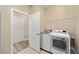 This laundry room features stainless steel appliances and a doorway at 9184 Sw 57Th Place Rd, Ocala, FL 34481