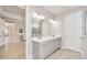 Elegant bathroom featuring a double sink vanity, modern lighting, and spacious layout at 9270 Sw 89Th Street Rd, Ocala, FL 34481