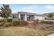 Charming single-story home with manicured landscaping and covered porch at 9270 Sw 89Th Street Rd, Ocala, FL 34481