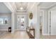 Bright foyer featuring hardwood floors and decorative lighting at 9270 Sw 89Th Street Rd, Ocala, FL 34481