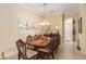 Traditional dining room with a large table and ornate decor at 9274 Sw 94Th Loop, Ocala, FL 34481