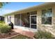 Exterior view of the home featuring a screened lanai, showcasing outdoor living space and backyard access at 9274 Sw 94Th Loop, Ocala, FL 34481