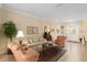 Inviting living room featuring neutral tones, tile flooring, and comfortable seating arrangement at 9274 Sw 94Th Loop, Ocala, FL 34481