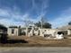 Construction site featuring the concrete block frame of a single-story house at 9361 Se 162Nd Pl, Summerfield, FL 34491