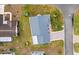 High-angle view of the well-maintained roof, landscaping, and hardscape of this property at 9750 Se 179Th Pl, Summerfield, FL 34491