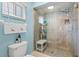 Bathroom showcasing a glass-enclosed walk-in shower and tile surround, with a built-in bench at 9750 Se 179Th Pl, Summerfield, FL 34491