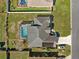 Directly above, capturing the full layout of a home with a screened pool, complemented by driveway parking at 10100 Se 69Th Ave, Belleview, FL 34420