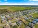 Overhead view of a residential community, with a home featuring a private screened-in pool and well-maintained yards at 10100 Se 69Th Ave, Belleview, FL 34420