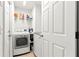 Functional laundry room equipped with modern washer and dryer units and ample storage at 10100 Se 69Th Ave, Belleview, FL 34420